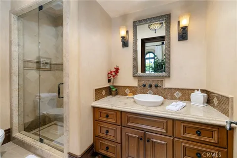 a bedroom with bed and balcony