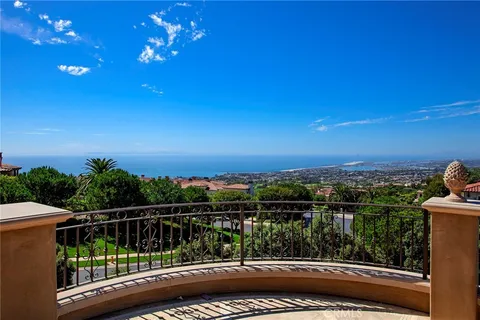 a bathroom with a granite countertop sink toilet mirror and shower