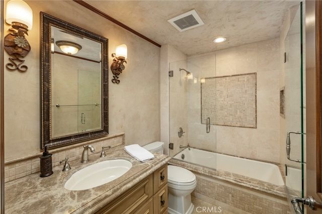 a living room with a table tennis table and a potted plant