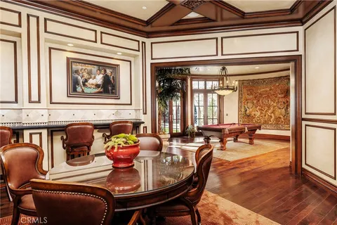 a living room with furniture a rug and a chandelier