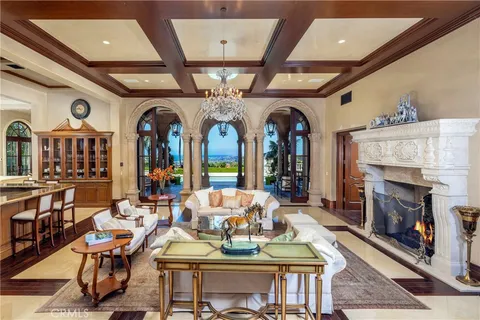 a living room with fireplace furniture and a fireplace