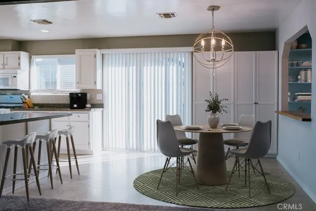 a view of a dining room with furniture