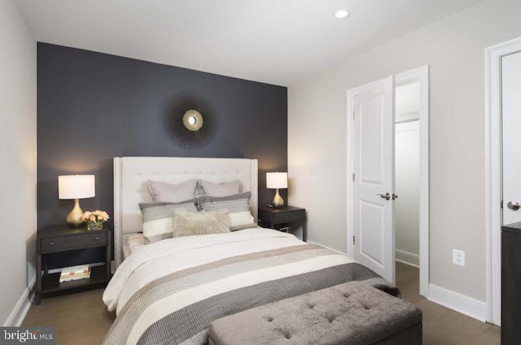 200 North 16th Street, Unit 701 Philadelphia, PA 19102 - Photo 75 of 82 a bedroom with a bed and a night stand