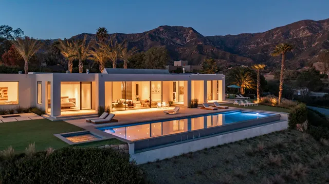 a view of a chairs and table in patio