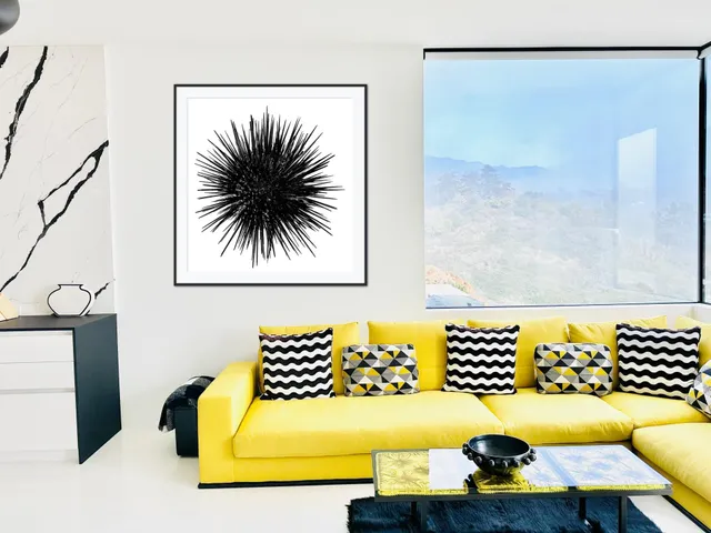 a bed sitting in a bedroom next to a large window with garden view