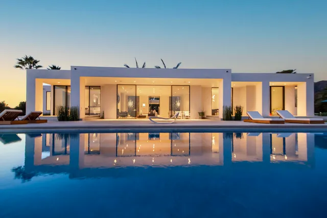 a view of a large swimming pool from a balcony