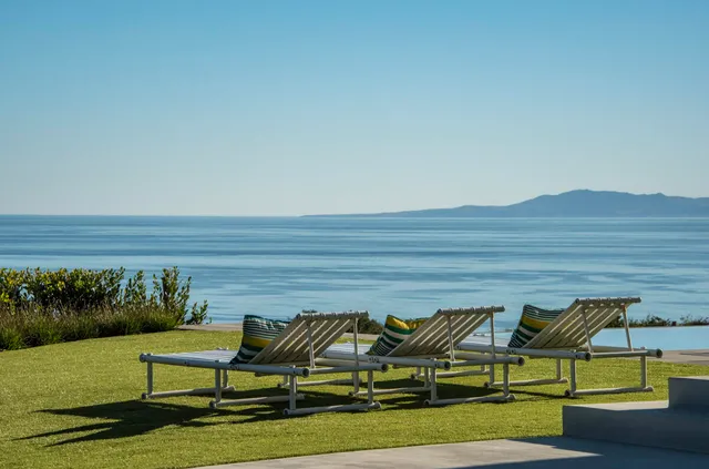 a view of swimming pool with seating space