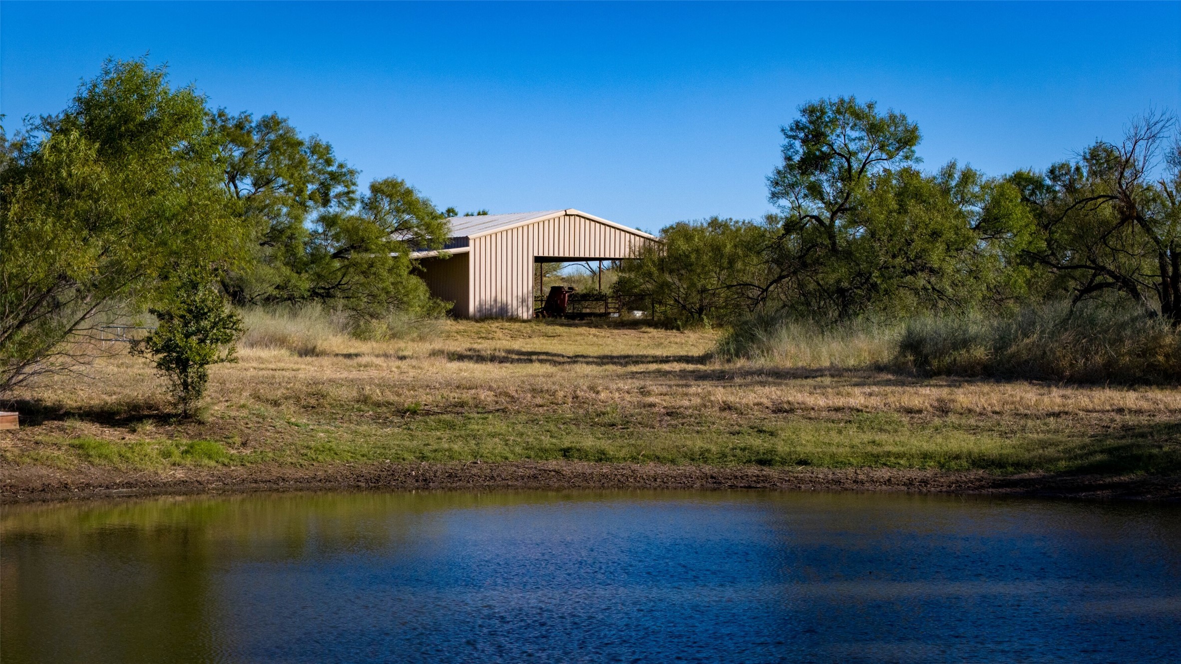 7702 Ranch Road 965 Llano, TX 78643 - Photo 32 of 40 a view of a house with a yard
