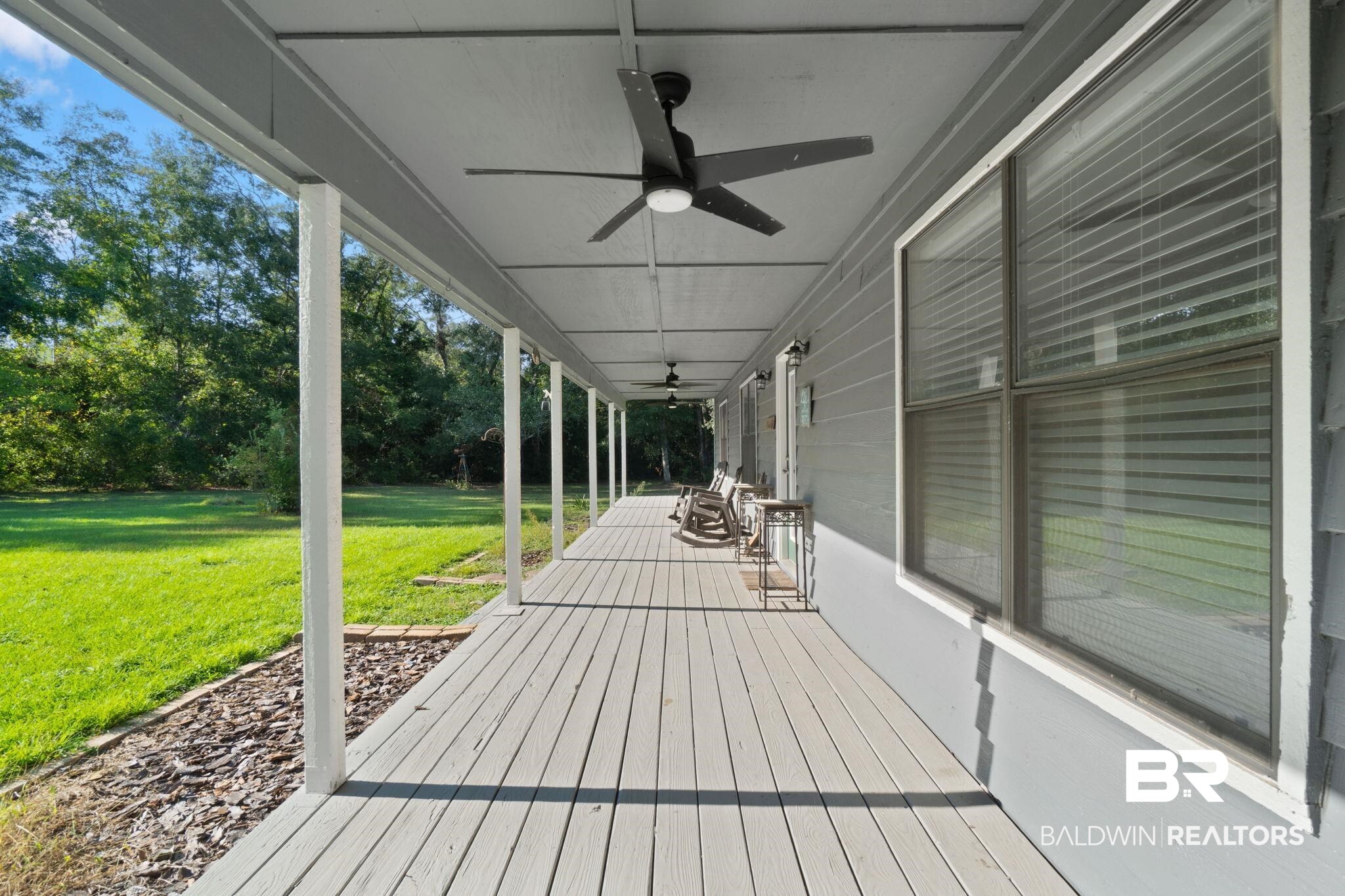 27300 C R Watson Road Robertsdale, AL 36567 - Photo 33 of 35 Deck with a yard and ceiling fan