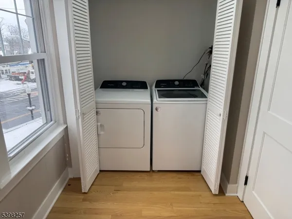 a view of storage and utility room with washer and dryer