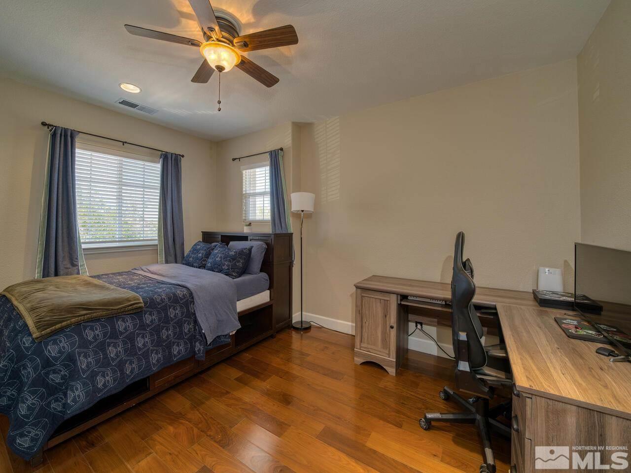 2984 Roundrock Court Reno, NV 89511 - Photo 27 of 40 a bedroom with a bed and a desk