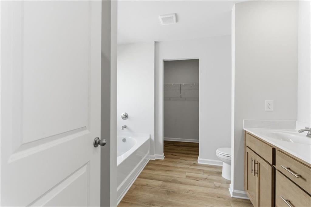 129 Bloomfield Circle Canton, GA 30114 - Photo 18 of 36 a bathroom with a sink and a mirror