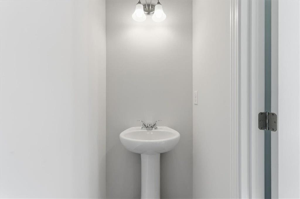 129 Bloomfield Circle Canton, GA 30114 - Photo 23 of 36 a bathroom with a sink and a mirror