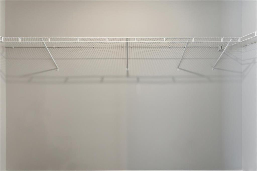 129 Bloomfield Circle Canton, GA 30114 - Photo 26 of 36 a view of a room with racks on the wall