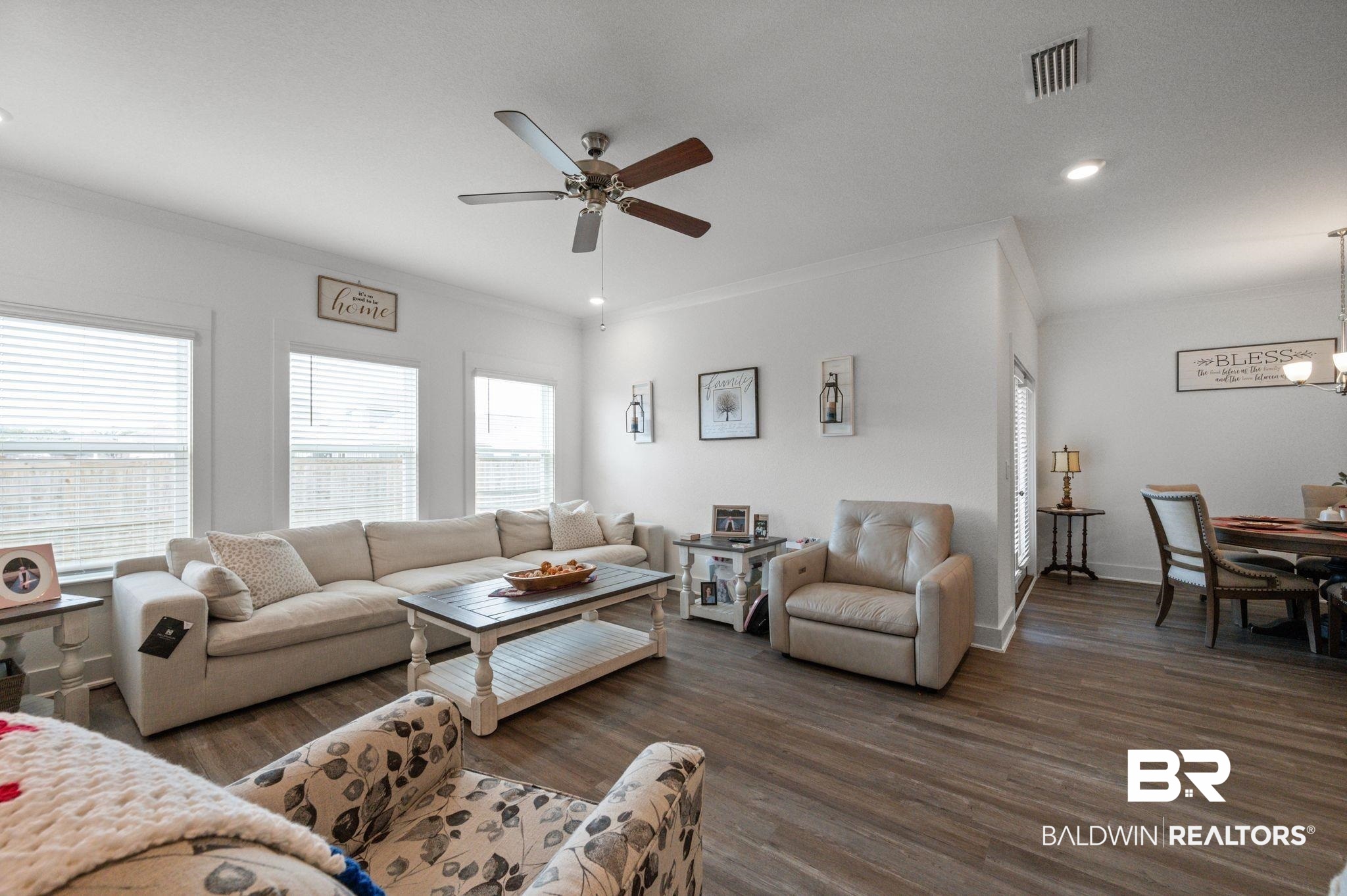 8508 Rosedown Lane Daphne, AL 36526 - Photo 17 of 29 Living area featuring dark wood-style floors, a ceiling fan, suspended lighting, and crown molding