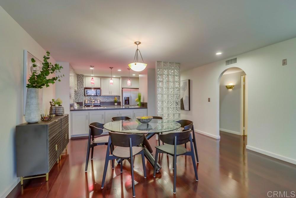 2500 Torrey Pines Road, Unit 402 La Jolla, CA 92037 - Photo 16 of 50 a view of a dining room with furniture and wooden floor
