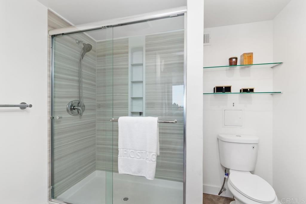 2500 Torrey Pines Road, Unit 402 La Jolla, CA 92037 - Photo 24 of 50 a bathroom with a shower and toilet