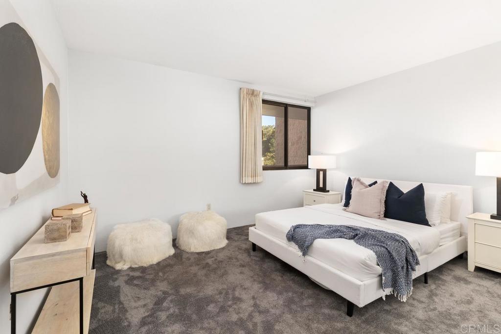 2500 Torrey Pines Road, Unit 402 La Jolla, CA 92037 - Photo 26 of 50 a bedroom with a bed and a window