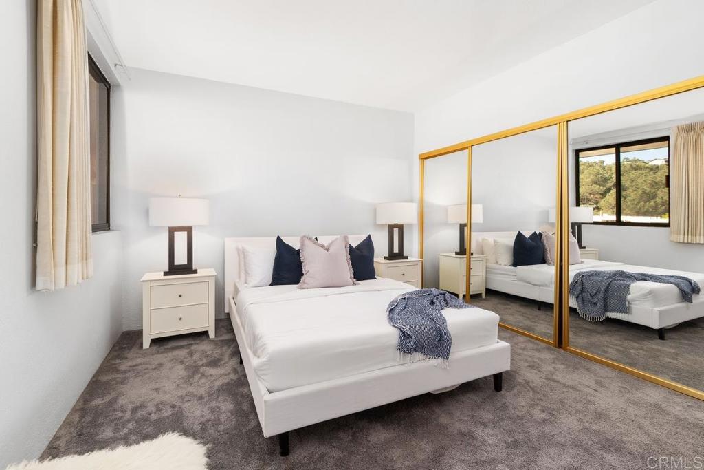 2500 Torrey Pines Road, Unit 402 La Jolla, CA 92037 - Photo 27 of 50 a bedroom with a bed and wooden floor