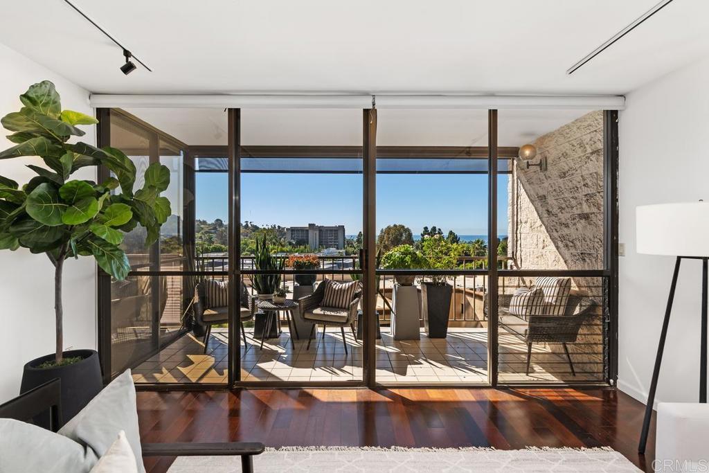 2500 Torrey Pines Road, Unit 402 La Jolla, CA 92037 - Photo 4 of 50 a view of a living room with gym equipment