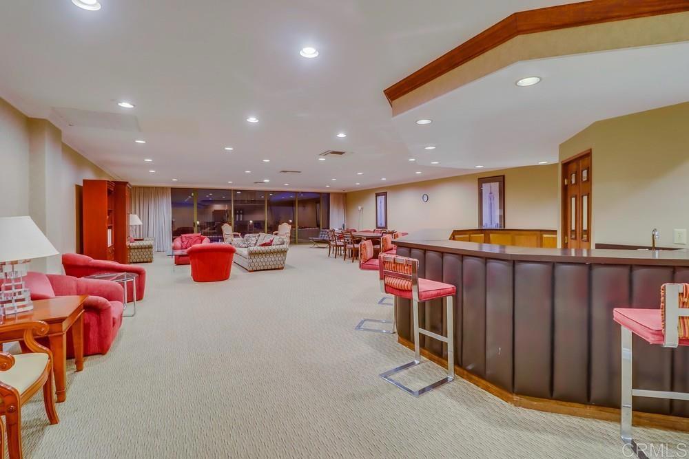 2500 Torrey Pines Road, Unit 402 La Jolla, CA 92037 - Photo 41 of 50 a living room with lots of furniture and a table