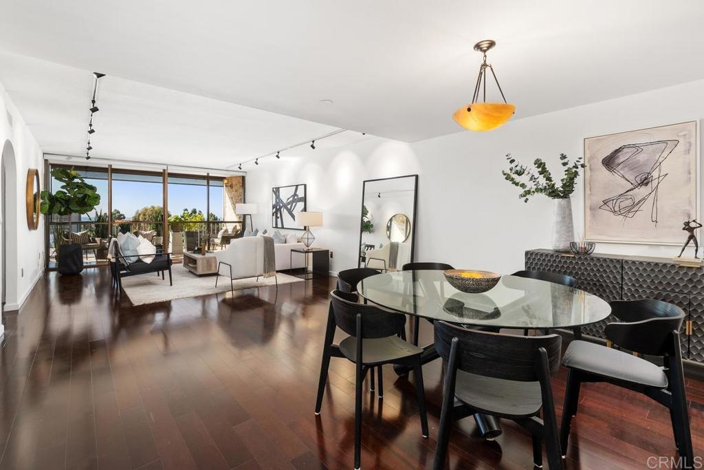 2500 Torrey Pines Road, Unit 402 La Jolla, CA 92037 - Photo 9 of 50 a view of a dining room with furniture and wooden floor