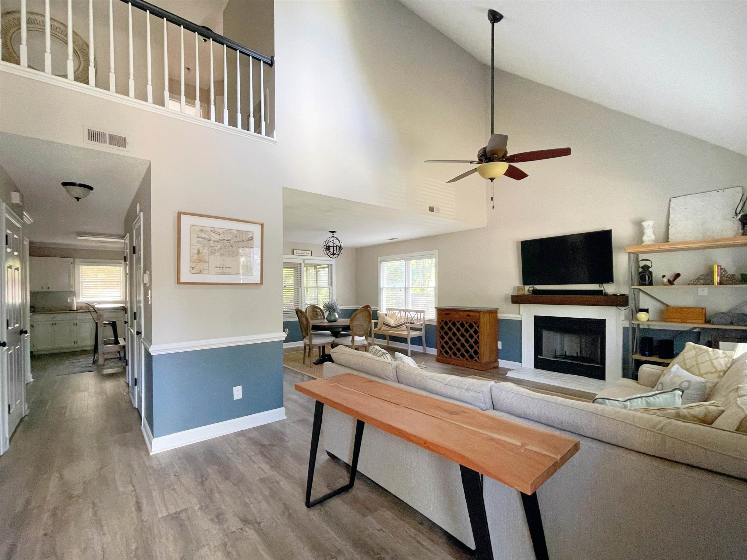4100 Settlement Drive Durham, NC 27713 - Photo 2 of 5 a living room with furniture a fireplace and a flat screen tv
