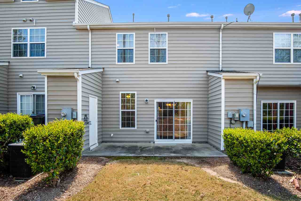 1809 Grace Point Road Morrisville, NC 27560 - Photo 13 of 22 Private patio area off of the living/dining space. Locked storage area off of patio. Water Heater location is in attic, so this storage area is a true storage space with shelving. Patio
