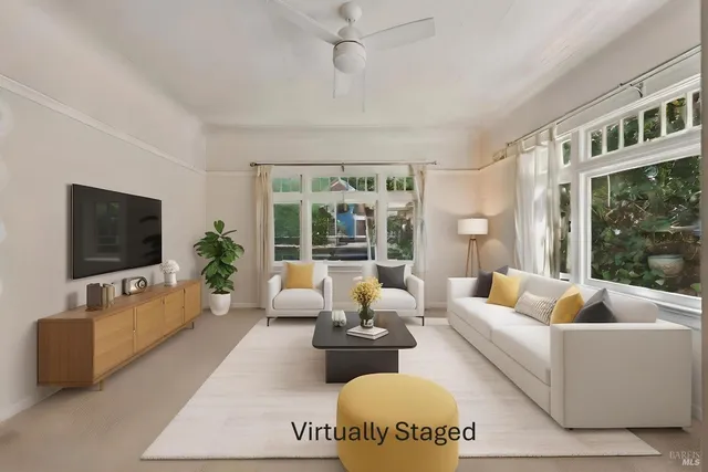 a living room with furniture wooden floor and a flat screen tv