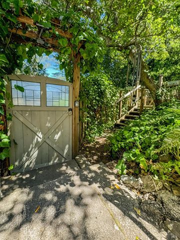 a view of a house with a tree