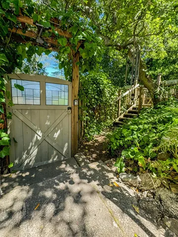 a view of a house with a tree