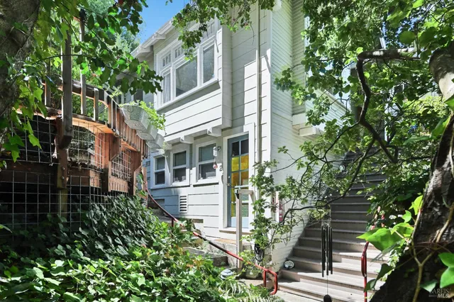 aerial view of a house with a tree