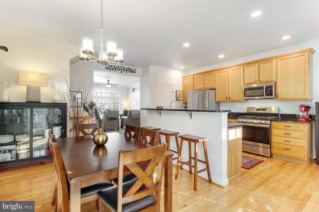 a view of a dining room with furniture and chandelier
