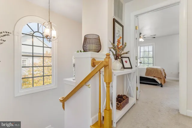 a bedroom with a bed couch and window