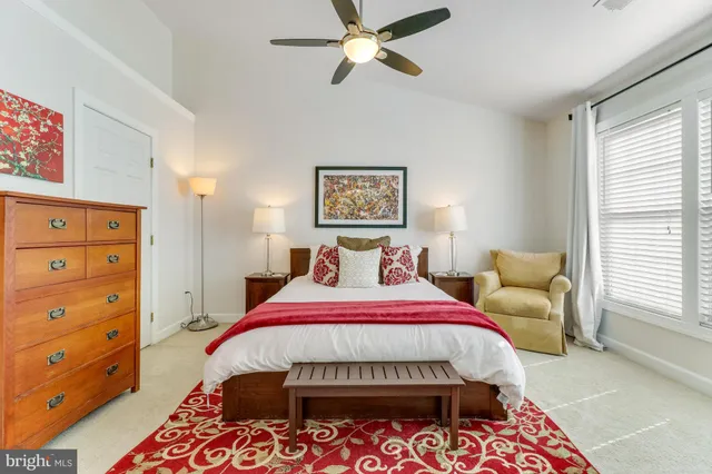 a bedroom with a balcony a bed and a tv