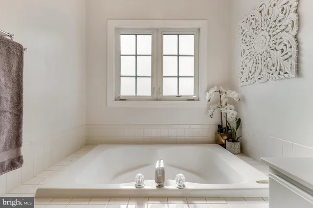 a bathroom with a shower and a tub