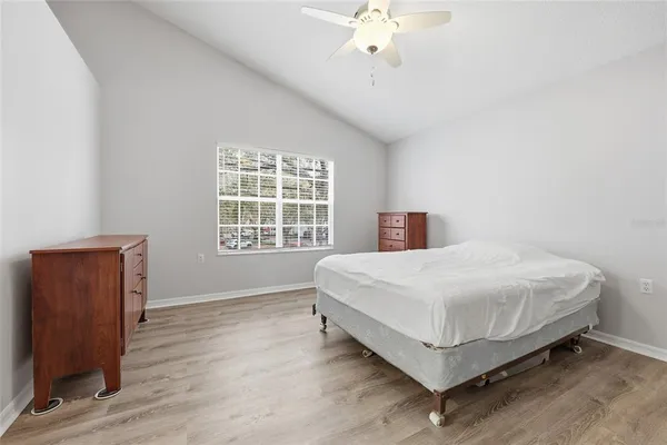 a bedroom with a bed and window