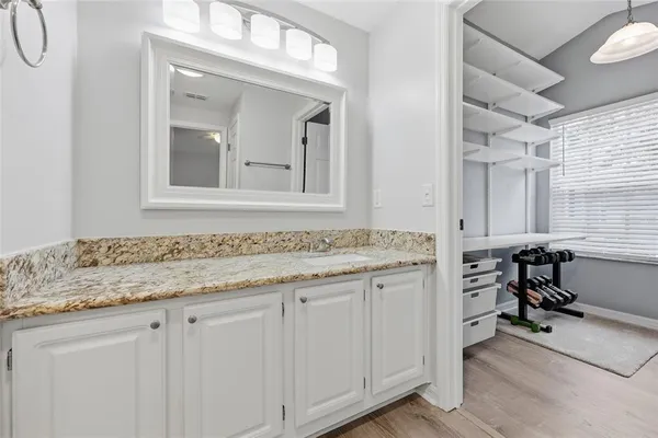 a bathroom with a sink and a mirror
