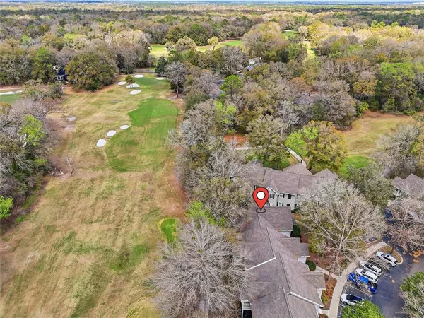 a view of a house with a yard and tree s
