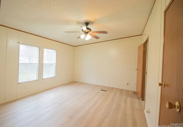 a view of an empty room with a window