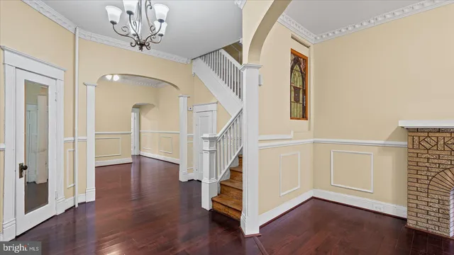 a view of entryway with wooden floor and staircase