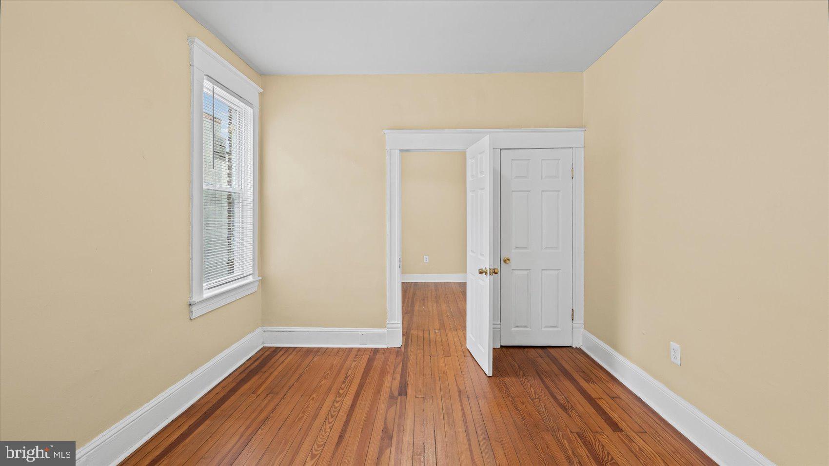 2413 Madison Avenue Baltimore, MD 21217 - Photo 14 of 48 a view of a room with wooden floor and window