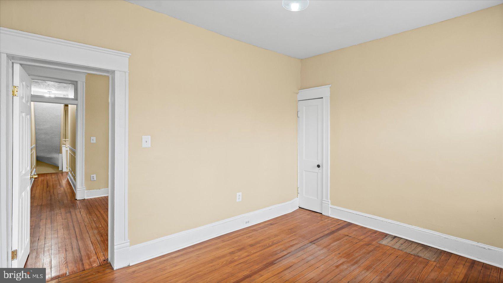 2413 Madison Avenue Baltimore, MD 21217 - Photo 20 of 48 a view of a hallway with wooden floor