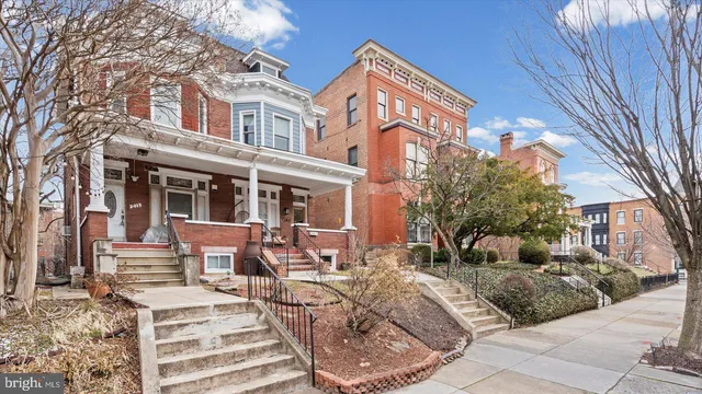 a view of a building with outdoor seating