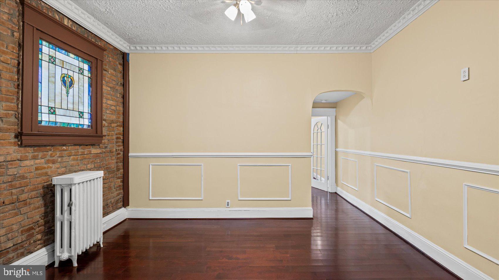 2413 Madison Avenue Baltimore, MD 21217 - Photo 6 of 48 a view of an entryway with wooden floor