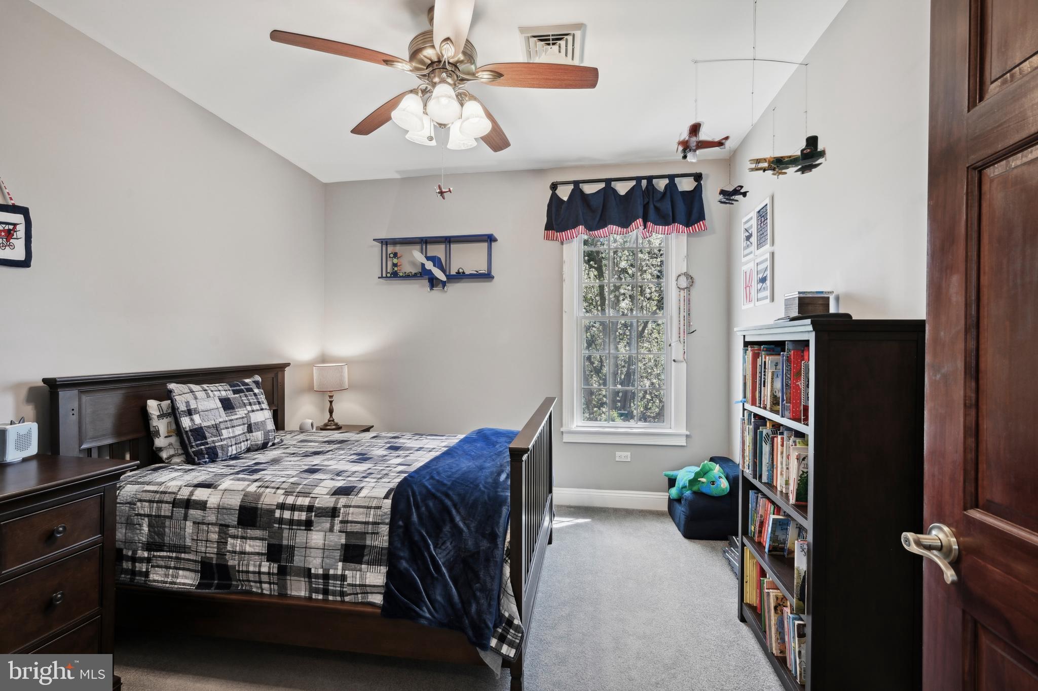 358 Eayrestown Road Southampton, NJ 08088 - Photo 20 of 54 a bedroom with bed and a chandelier
