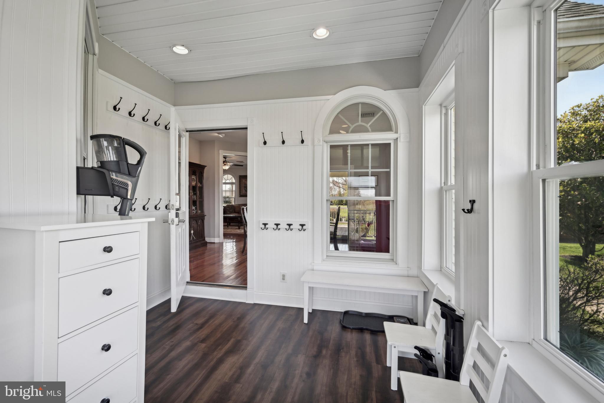 358 Eayrestown Road Southampton, NJ 08088 - Photo 23 of 54 a view of front door with hallway and wooden floor
