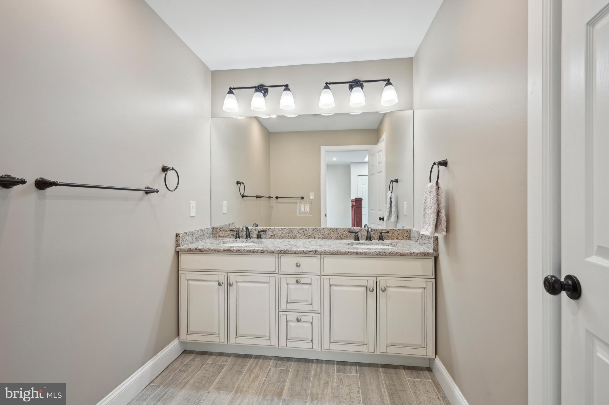 358 Eayrestown Road Southampton, NJ 08088 - Photo 26 of 54 a bathroom with a granite countertop sink and a mirror