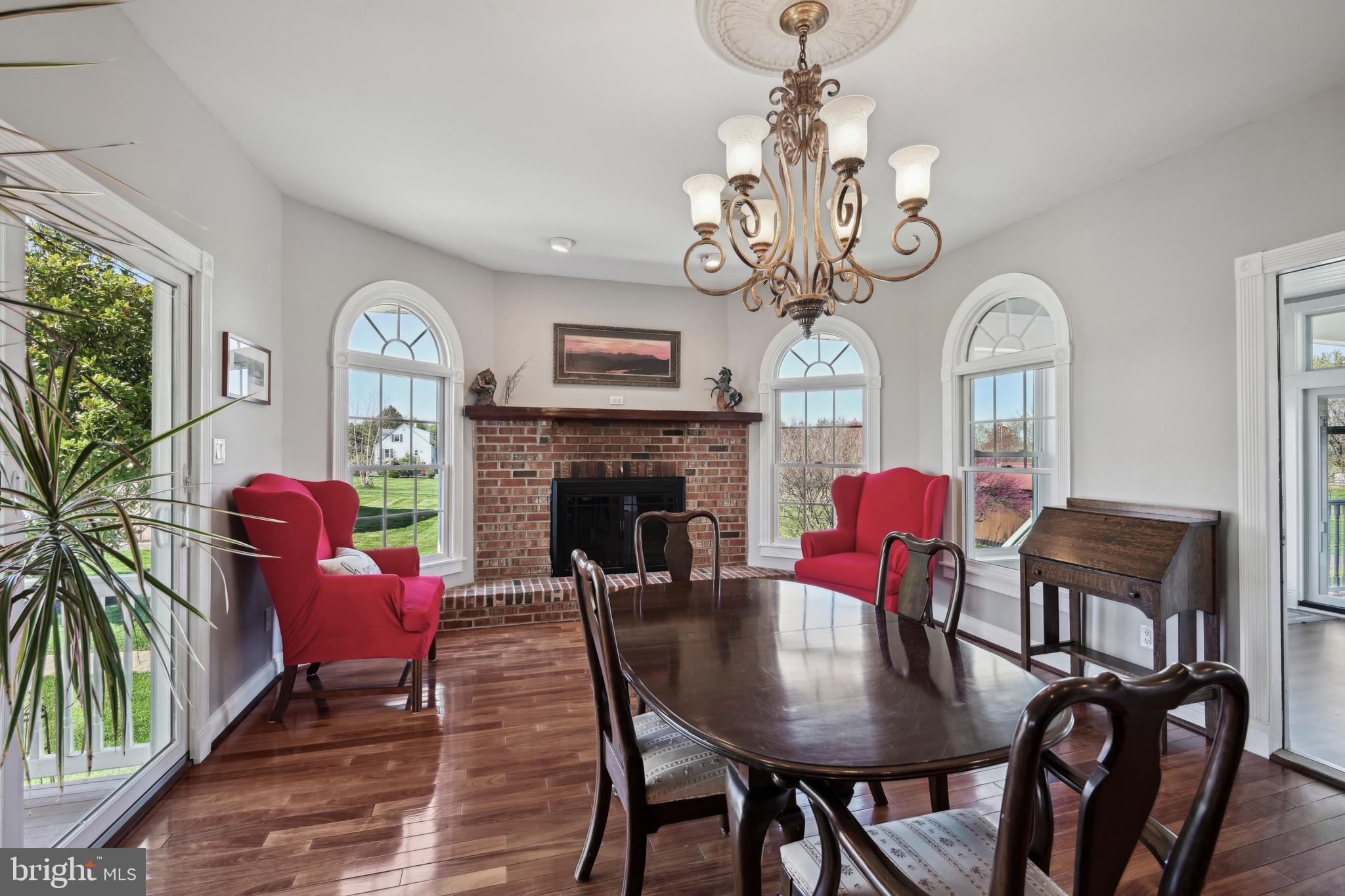 358 Eayrestown Road Southampton, NJ 08088 - Photo 9 of 54 a living room with furniture a chandelier and a fireplace