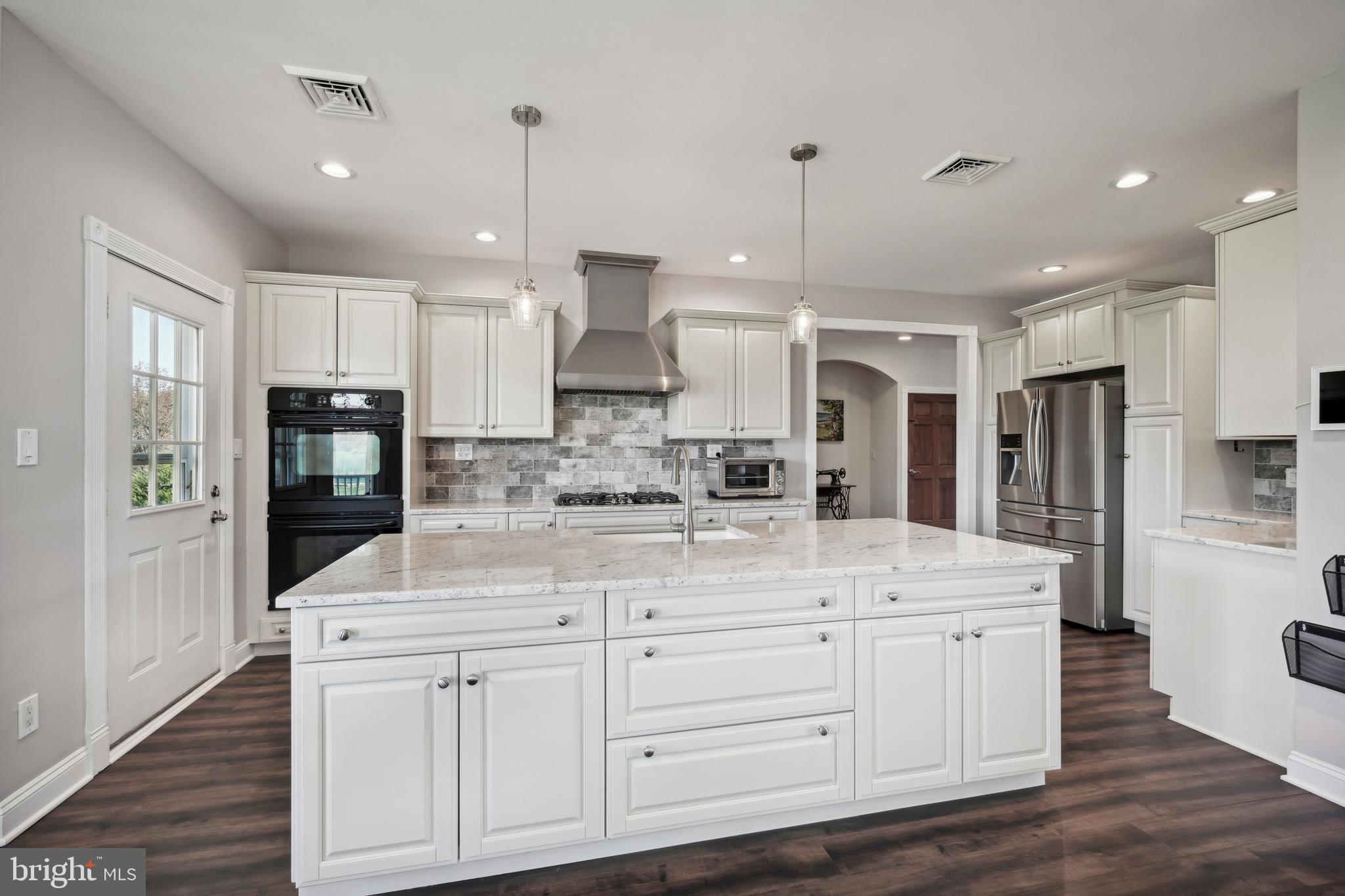 358 Eayrestown Road Southampton, NJ 08088 - Photo 10 of 54 a kitchen with kitchen island white cabinets and stainless steel appliances